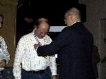 Dan Grunloh (left) receives the gold medal from Dave Hempy for his competition in the 7th National Microlight Championships.